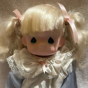 I am selling a Precious Moments doll.